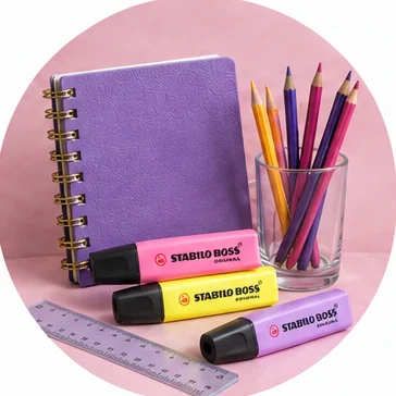 Purple notebook, pencils and colourful highlighters