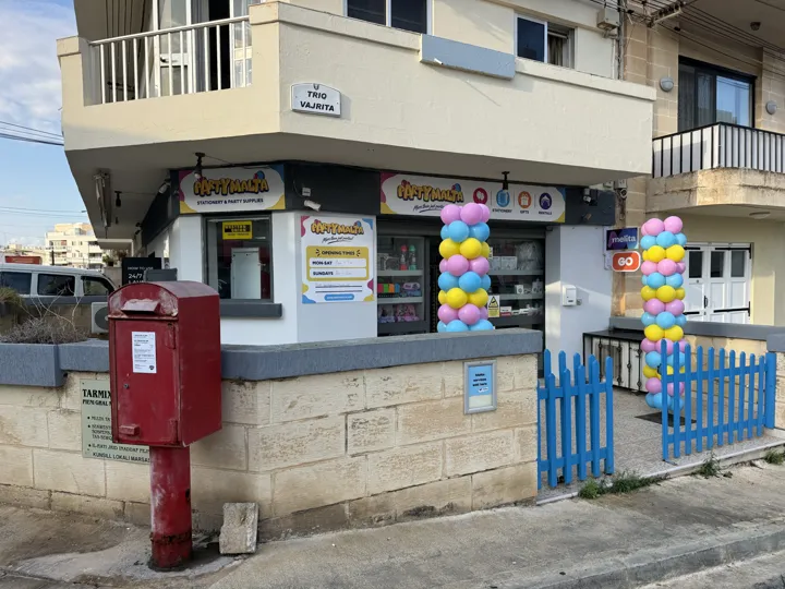 PartyMalta shop entrance with colourful balloon columns