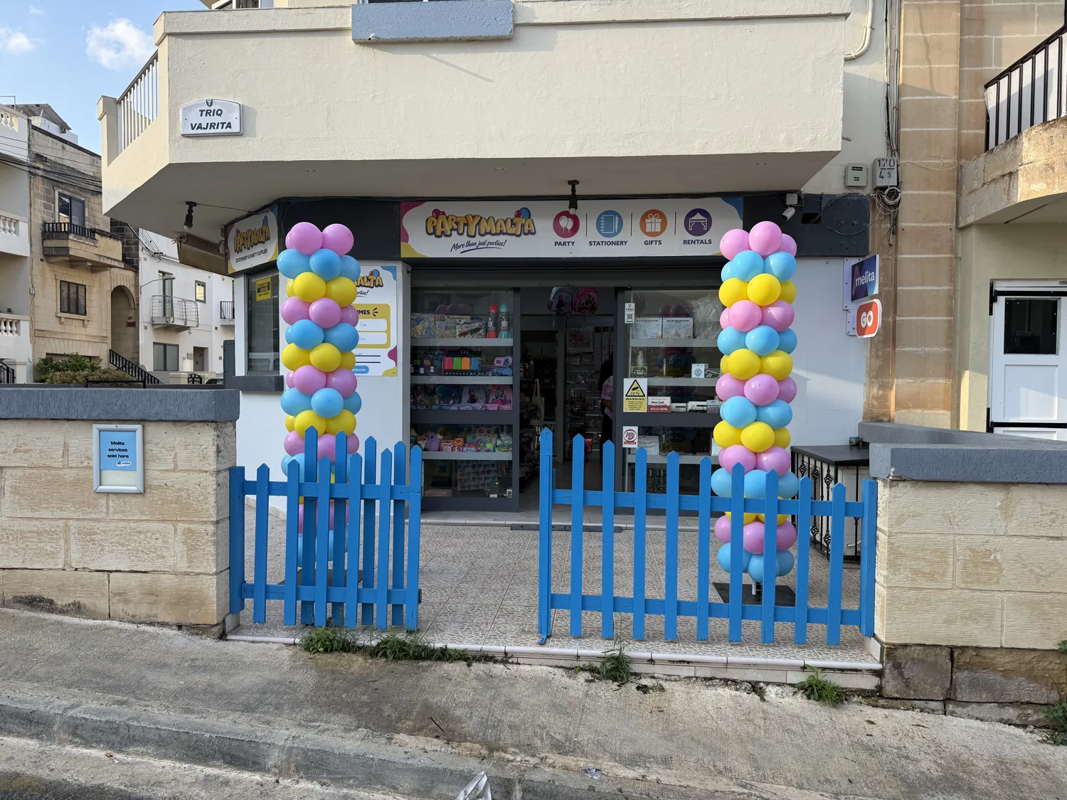 PartyMalta storefront and blue entrance gate on Triq Vajrita, Marsaskala